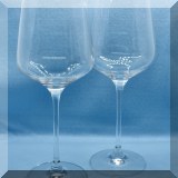 G14. Pair of tall wine glasses. Marked with toasting man. 10.5”h - $8 